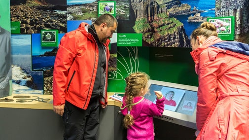 Family in the visitor centre at the Giant's Causeway, County Antrim